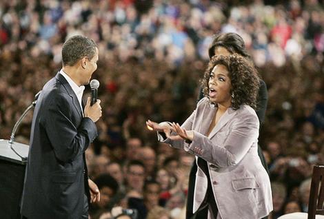 U.S. Democratic Presidential candidate Obama is joined by talk show host Oprah Winfrey and his wife Michelle at a rally in Des Moines