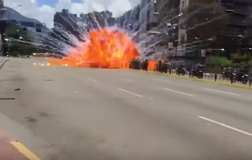 Watch: Venezuelan Police Engulfed In Flames After IED Explodes in Caracas